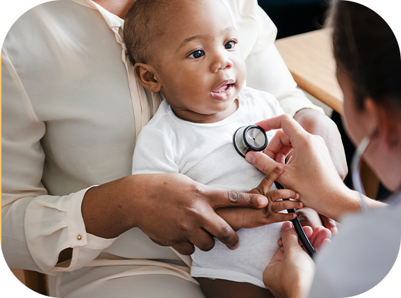 Baby at pediatrician with stethoscope on heart